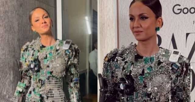 Natasha Poonawalla wears a dress made out of old CDs, calculators, mobile phones